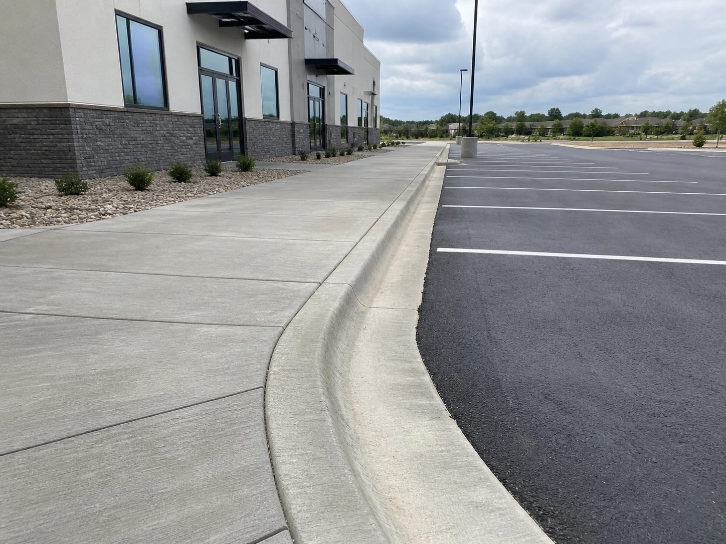 Cracked and heaved concrete driveway in Raytown, MO before replacement
